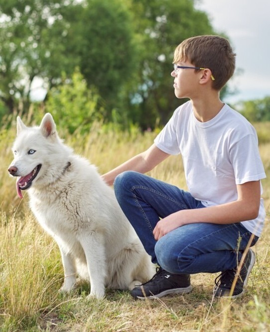 autism treatment for children teenage boy outside with dog living a normal life